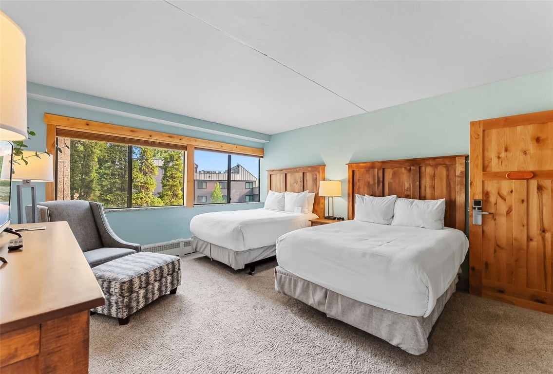 601 Village Road, Unit 501 Breckenridge, CO 80424 - Photo 35 of 50 a spacious bedroom with a bed and glass window