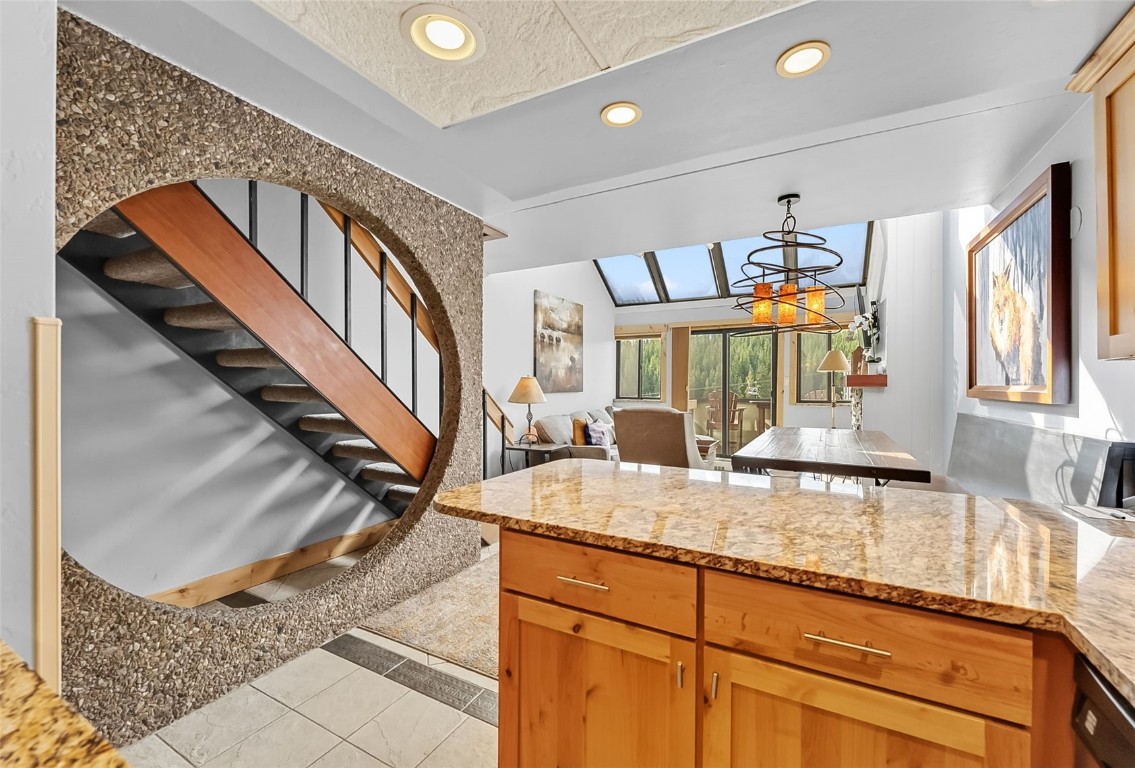 601 Village Road, Unit 501 Breckenridge, CO 80424 - Photo 10 of 50 a view of a livingroom with furniture staircase and kitchen view