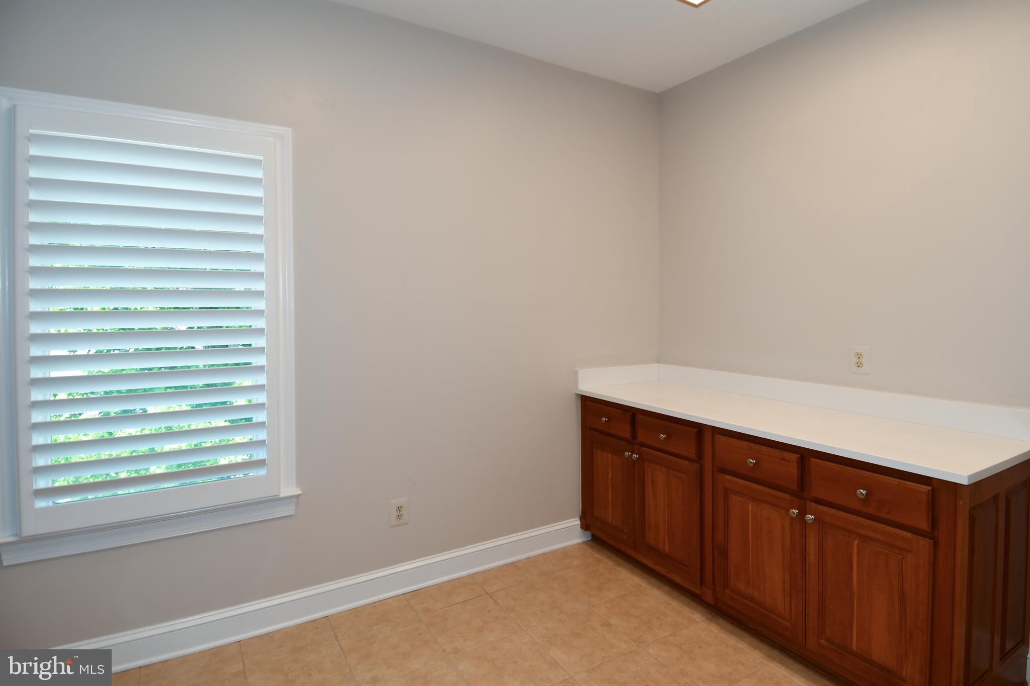 7808 Southdown Road Alexandria, VA 22308 - Photo 87 of 99 a room with a cabinets and a window