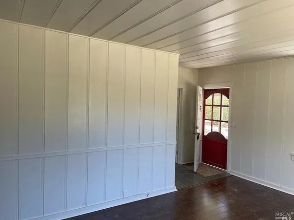 a view of entryway with wooden floor