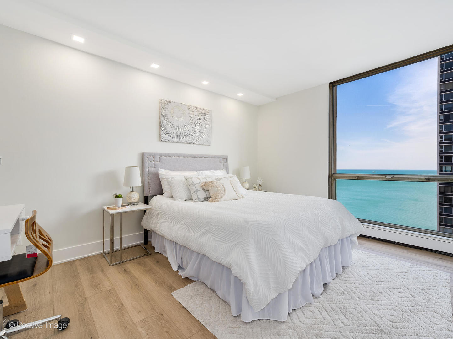 1310 North Ritchie Court, Unit 27C Chicago, IL 60610 - Photo 19 of 30 a bedroom with a bed and a flat screen tv