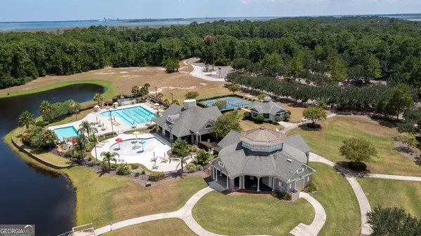 an aerial view of a house with outdoor space