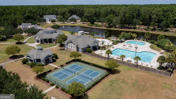 an aerial view of a house with a lake view