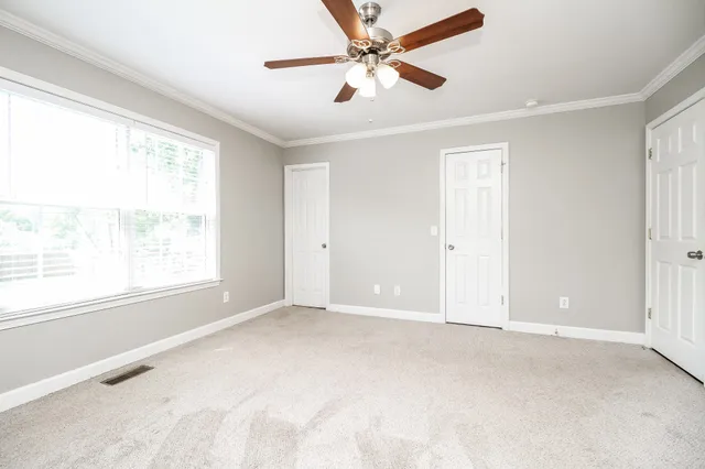 a view of an empty room with a window