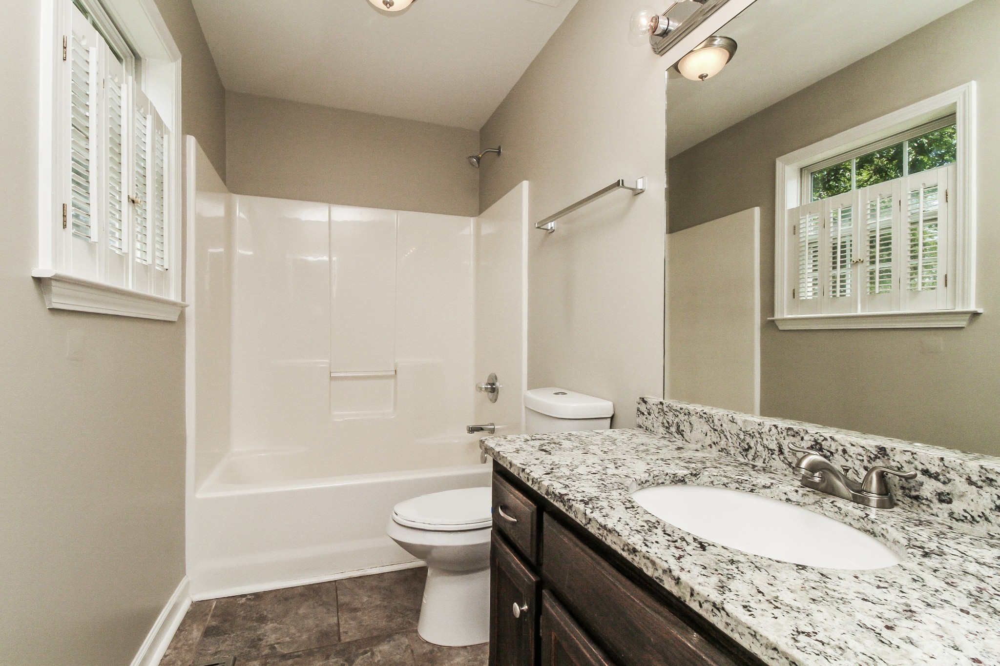 2921 Stapleton Drive Spring Hill, TN 37174 - Photo 10 of 17 a bathroom with a granite countertop sink toilet and shower
