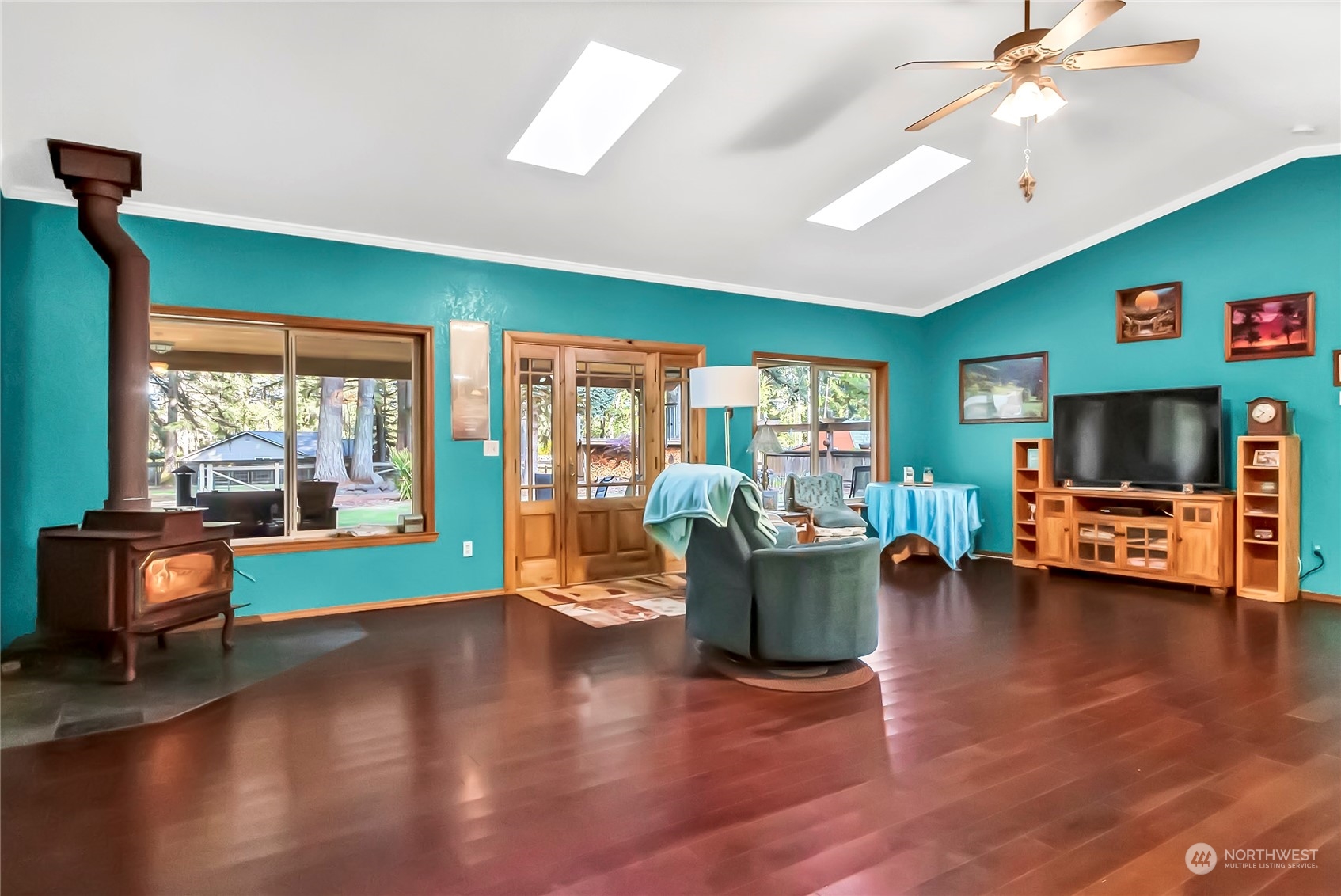 5412 133rd Avenue Southwest Rochester, WA 98579 - Photo 21 of 31 a living room with furniture and a wooden floor
