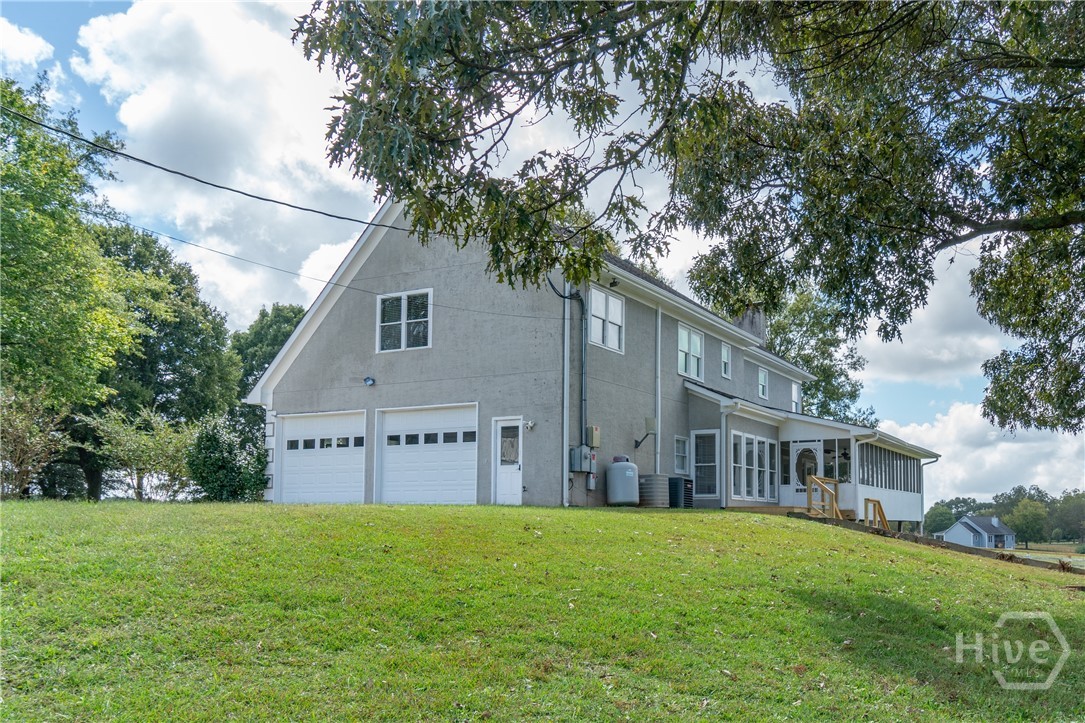 1963 Rehoboth Road Bowman, GA 30624 - Photo 15 of 64 Garage and side of house