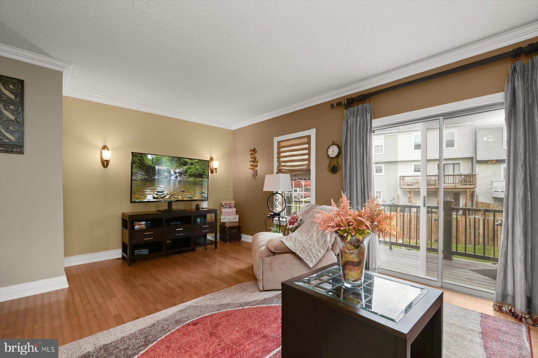 737 St Michaels Drive Bowie, MD 20721 - Photo 12 of 41 a living room with furniture and a flat screen tv