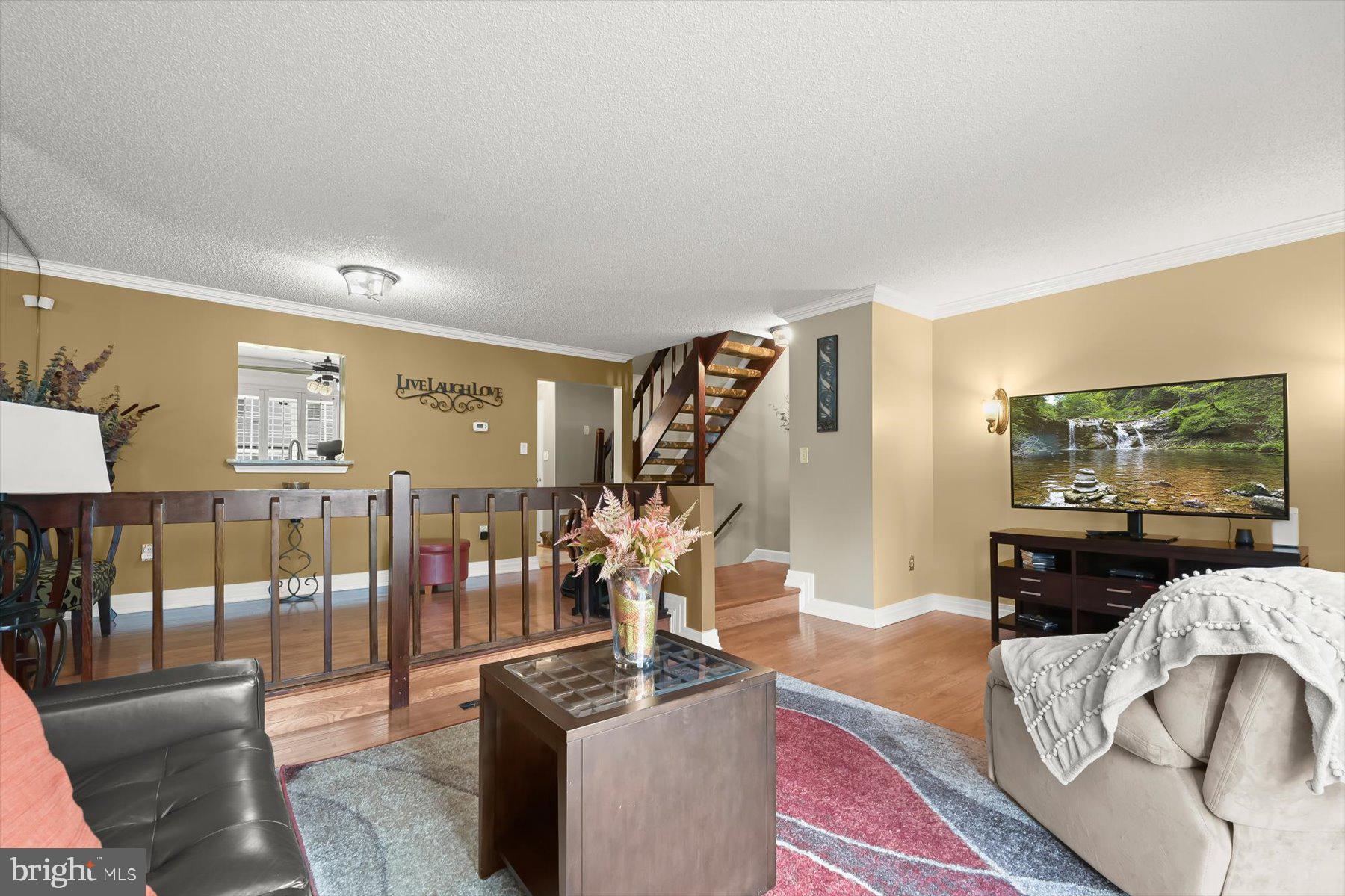 737 St Michaels Drive Bowie, MD 20721 - Photo 13 of 41 a living room with furniture and a flat screen tv