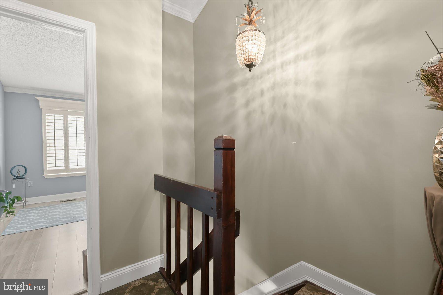 737 St Michaels Drive Bowie, MD 20721 - Photo 20 of 41 a view of a hallway with wooden floor and staircase