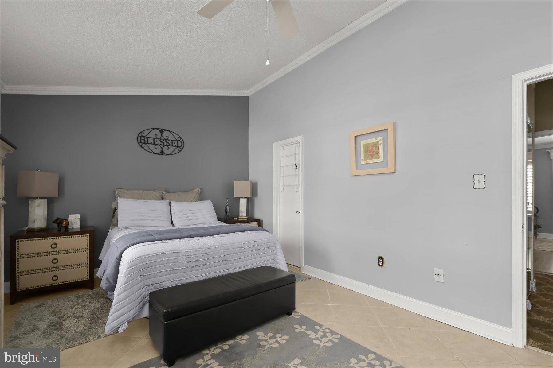 737 St Michaels Drive Bowie, MD 20721 - Photo 23 of 41 a bedroom with a bed and a wall painting