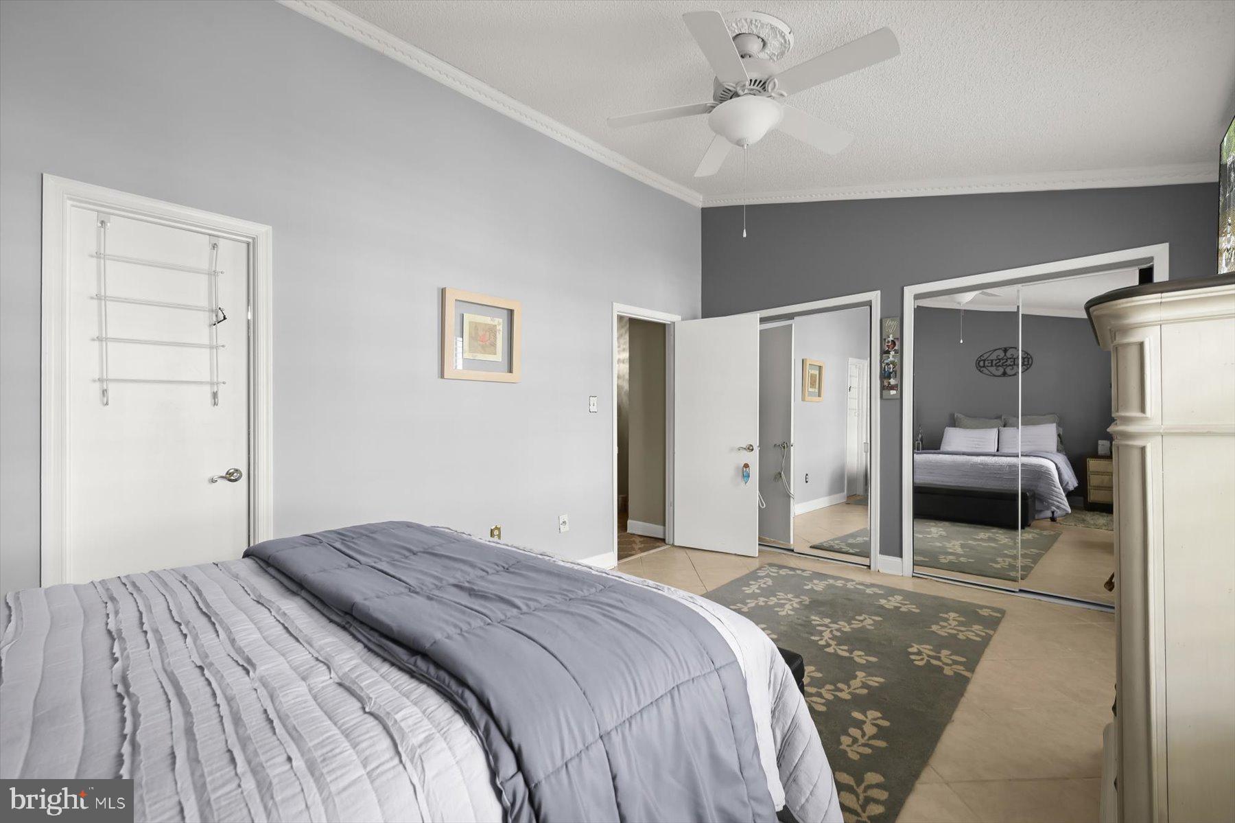 737 St Michaels Drive Bowie, MD 20721 - Photo 24 of 41 a bedroom with a bed and a refrigerator