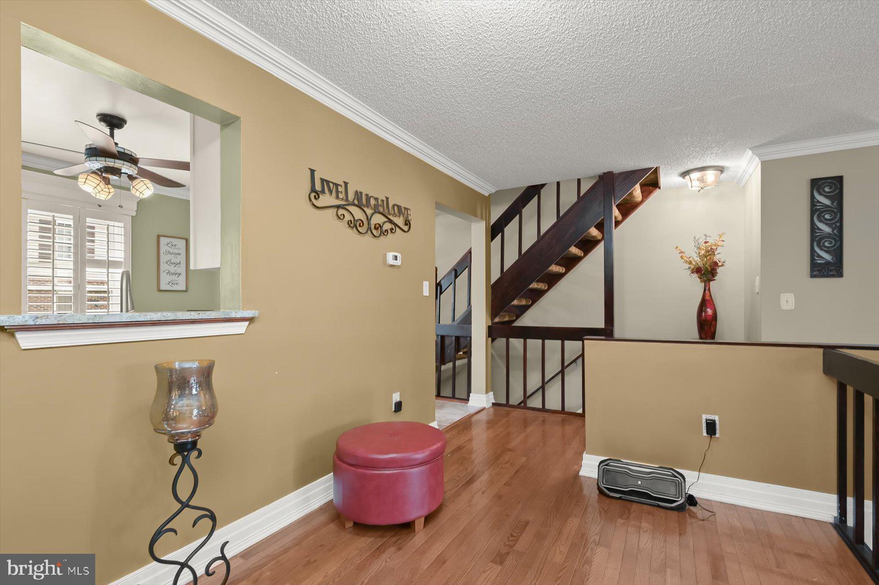 737 St Michaels Drive Bowie, MD 20721 - Photo 9 of 41 a view of a hallway with wooden floor and staircase