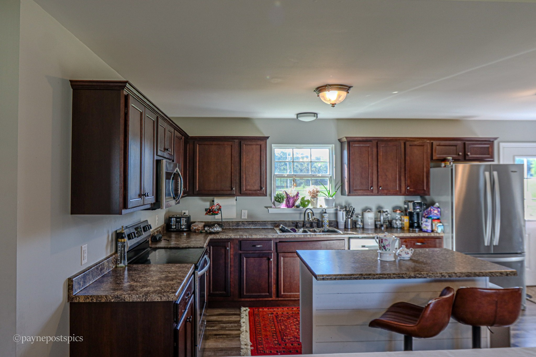 381 Bethany Road McMinnville, TN 37110 - Photo 8 of 18 a kitchen with granite countertop a sink stove and cabinets
