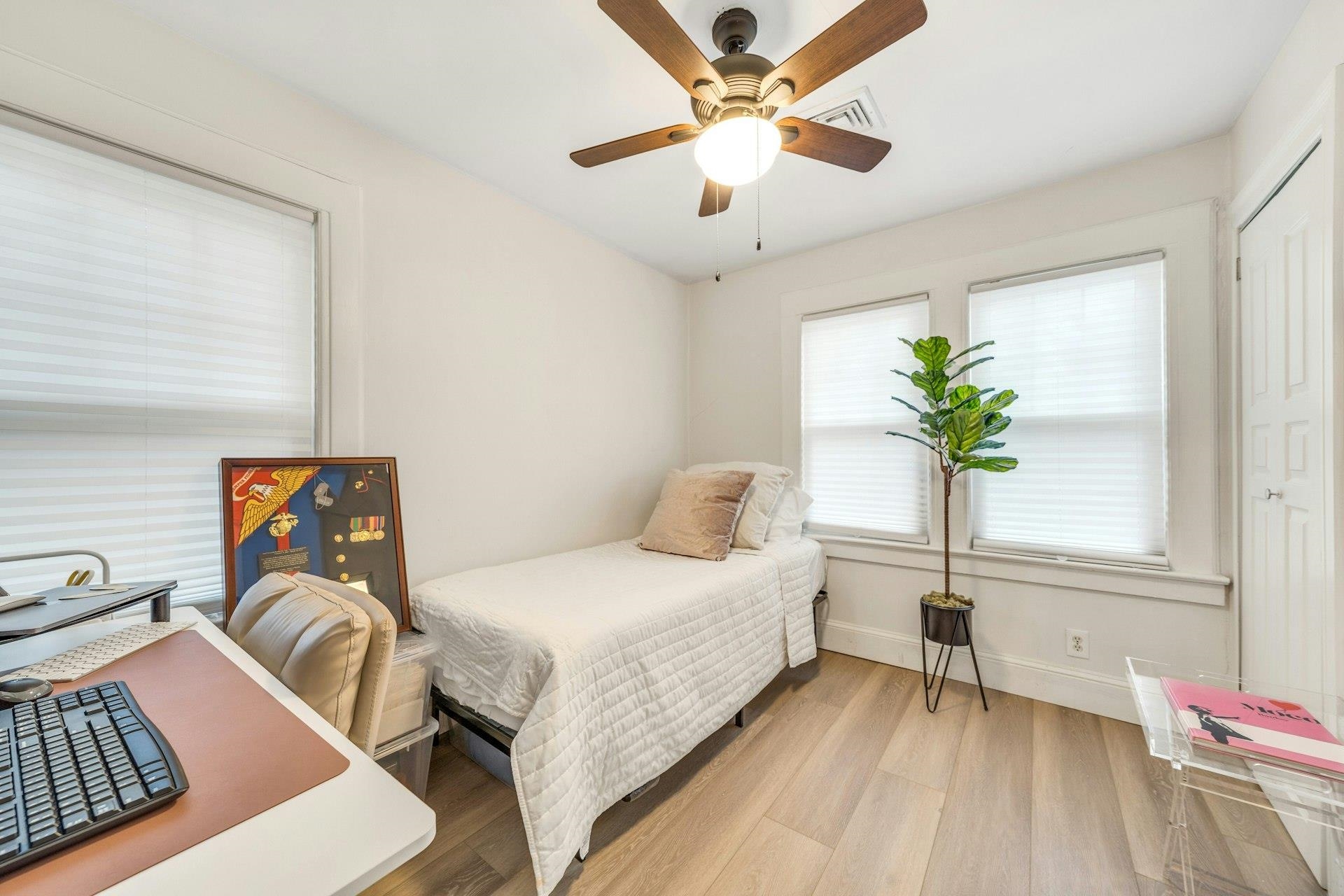 67 Hillcrest Road Kearny, NJ 07032 - Photo 14 of 30 a bedroom with a bed and a chandelier