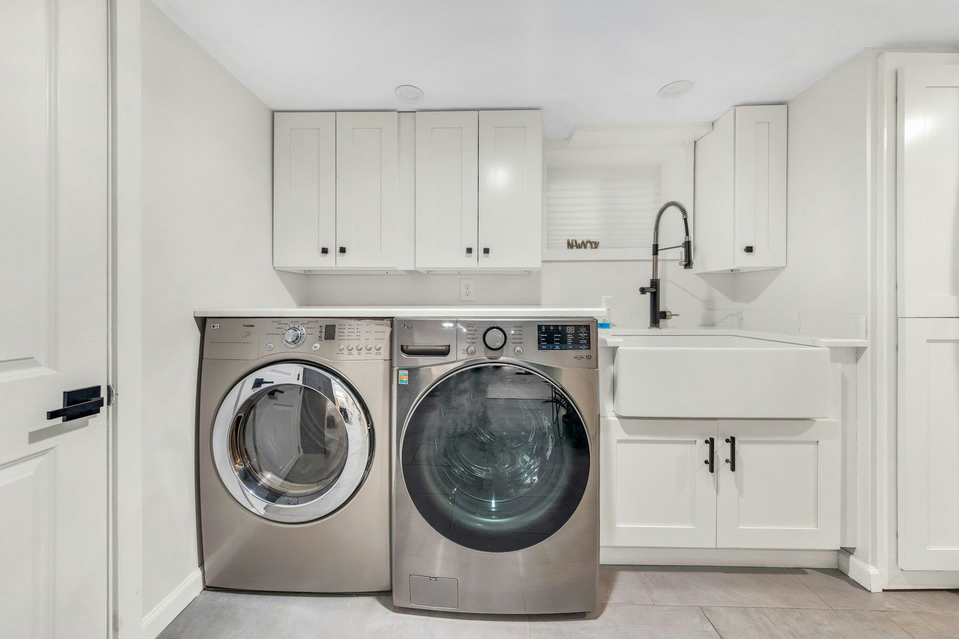 67 Hillcrest Road Kearny, NJ 07032 - Photo 26 of 30 a utility room with sink dryer and washer