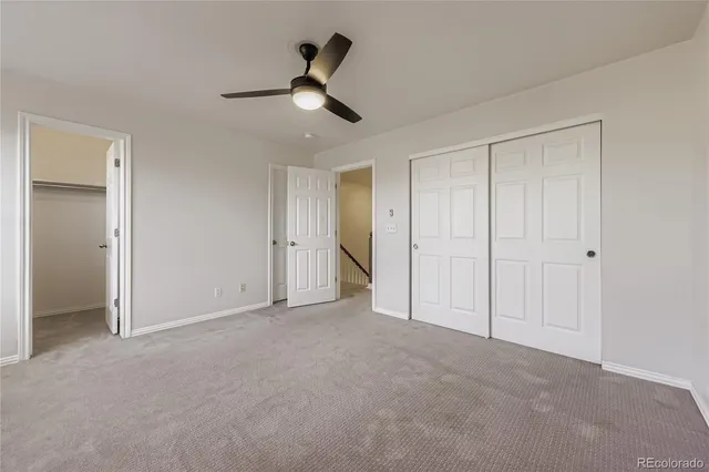 a view of an empty room and closet area