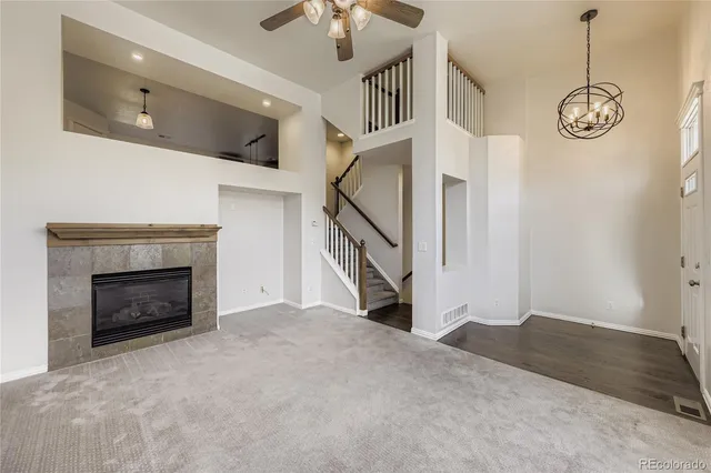 a view of an empty room with a fireplace