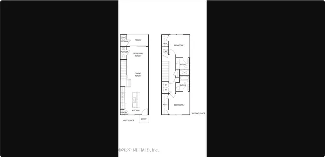 a view of a living room with a black and white wall