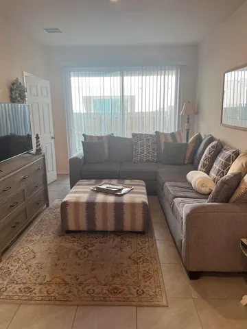 a living room with furniture and a couch