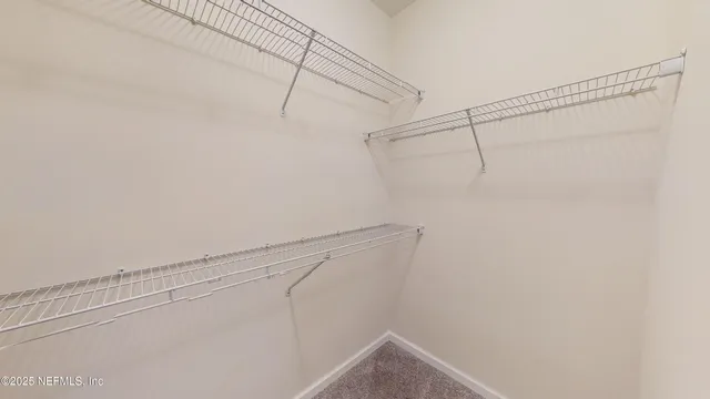 a view of a room with racks on the wall