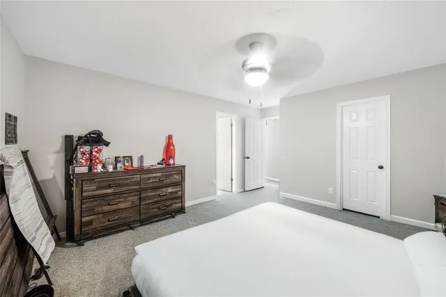 a bed room with a bed and a chandelier