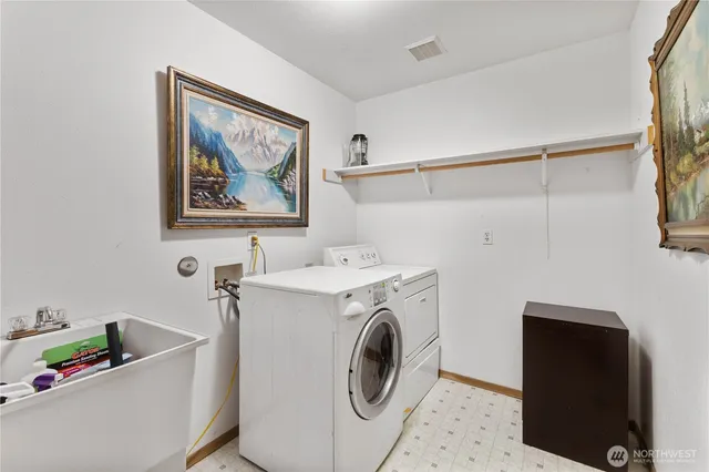 a utility room with dryer and washer