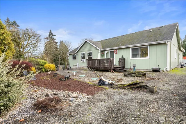 a view of house with backyard space and balcony