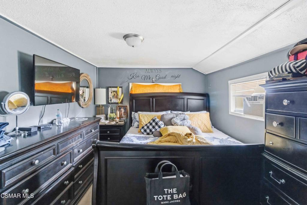 2874 School Street Simi Valley, CA 93065 - Photo 15 of 48 a bed sitting in a bedroom next to a window