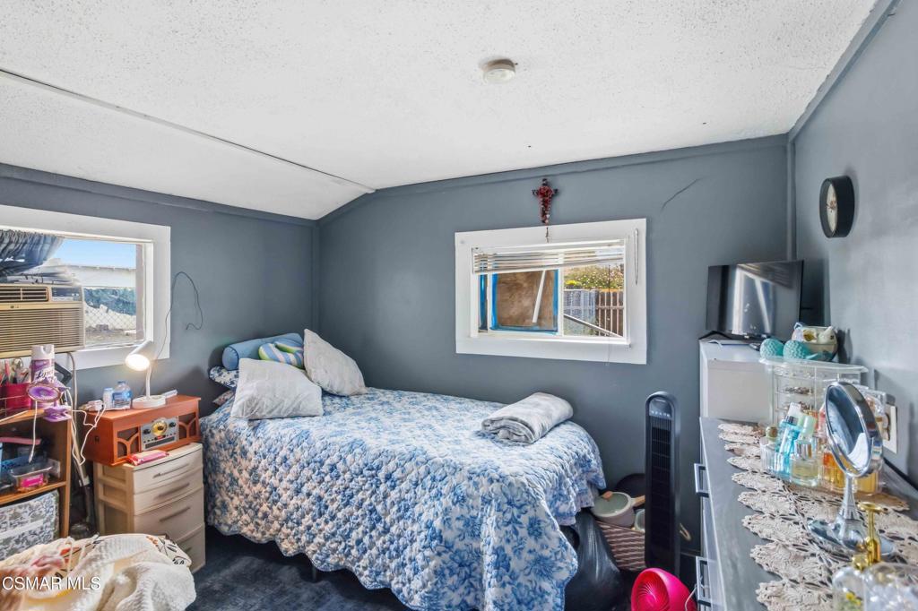 2874 School Street Simi Valley, CA 93065 - Photo 17 of 48 a bedroom with a bed and wooden floor
