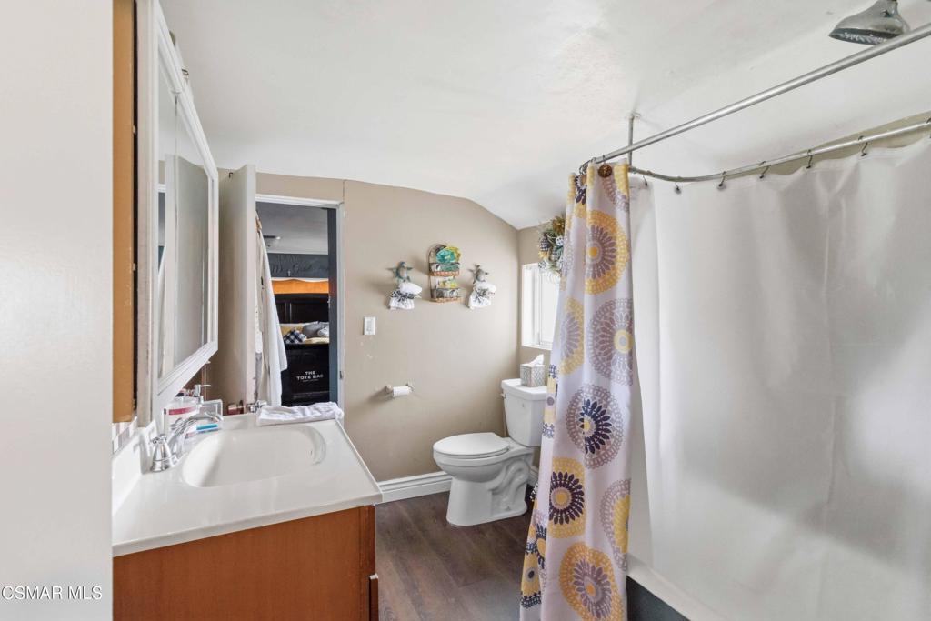 2874 School Street Simi Valley, CA 93065 - Photo 19 of 48 a bathroom with a sink vanity mirror and toilet