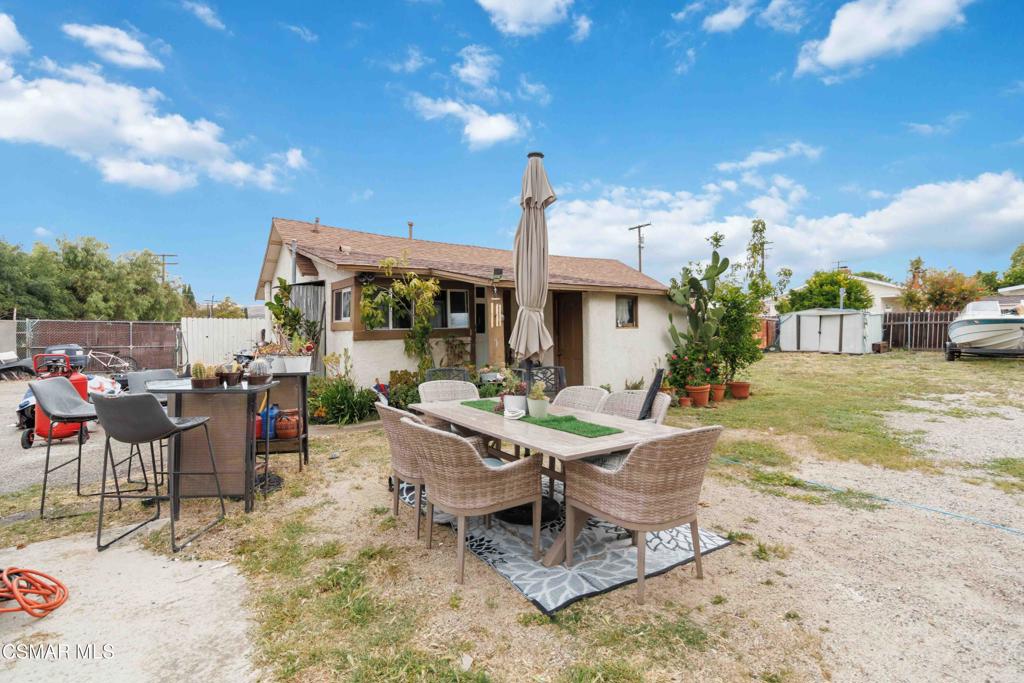 2874 School Street Simi Valley, CA 93065 - Photo 39 of 48 a view of a patio with table and chairs and potted plants