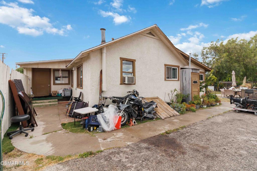 2874 School Street Simi Valley, CA 93065 - Photo 47 of 48 a view of a house with patio furniture and a bike