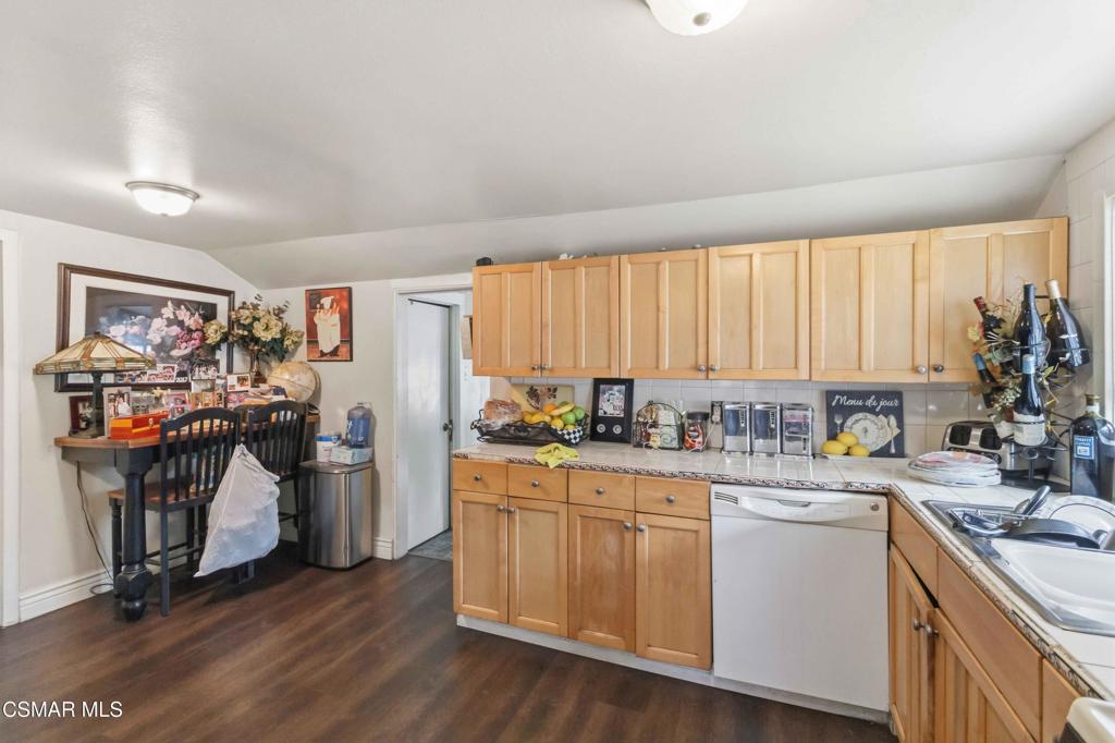 2874 School Street Simi Valley, CA 93065 - Photo 9 of 48 a kitchen with a sink stove and cabinets