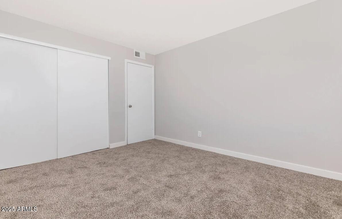 10860 North 85th Avenue, Unit 2 Peoria, AZ 85345 - Photo 7 of 16 a view of an empty room
