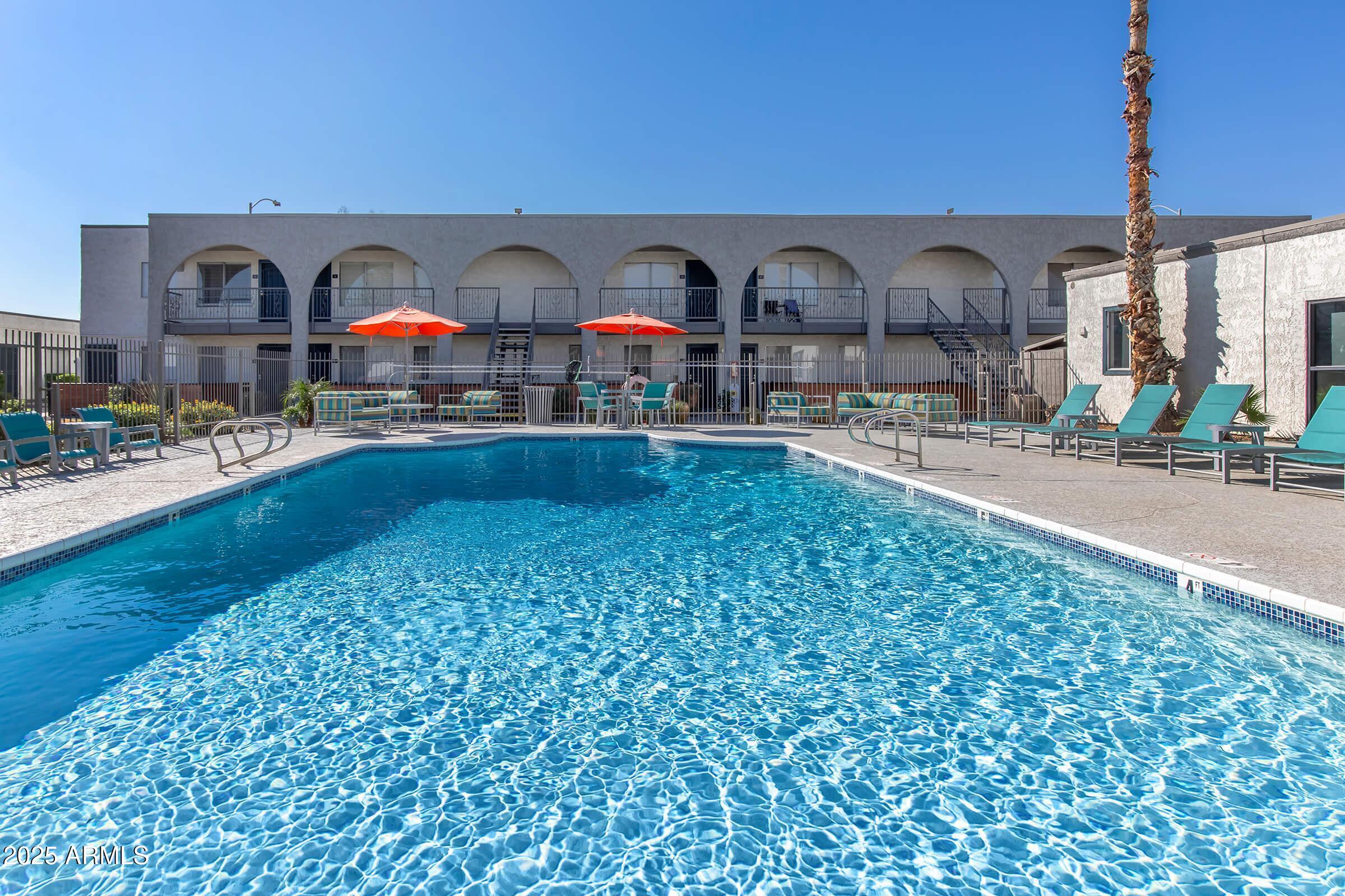 10860 North 85th Avenue, Unit 2 Peoria, AZ 85345 - Photo 10 of 16 a living room with furniture and a fireplace