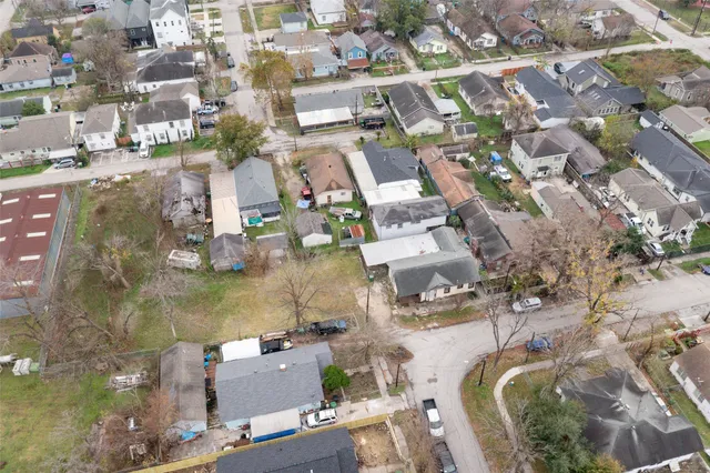 an aerial view of houses with outdoor space