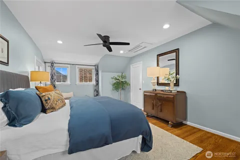 a bed room with a bed and a tv