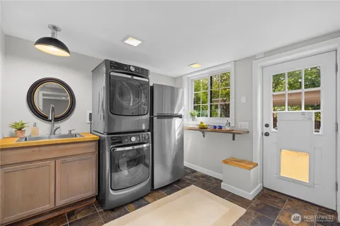 a kitchen with a sink and a stove top oven