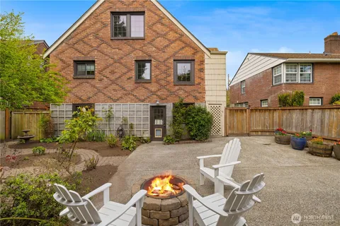 a view of a patio with couches chairs and potted plants