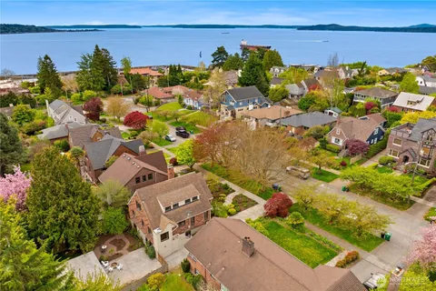 an aerial view of a house with a yard