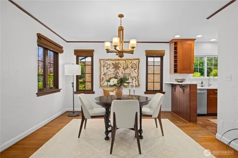 a dining room with furniture and window