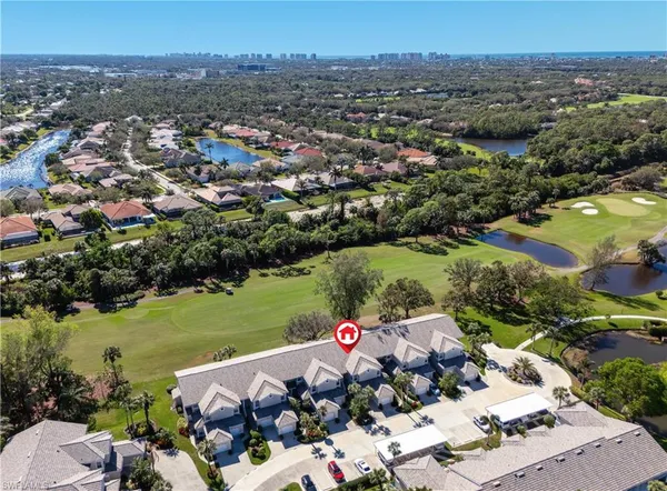 an aerial view of a house with a lake view