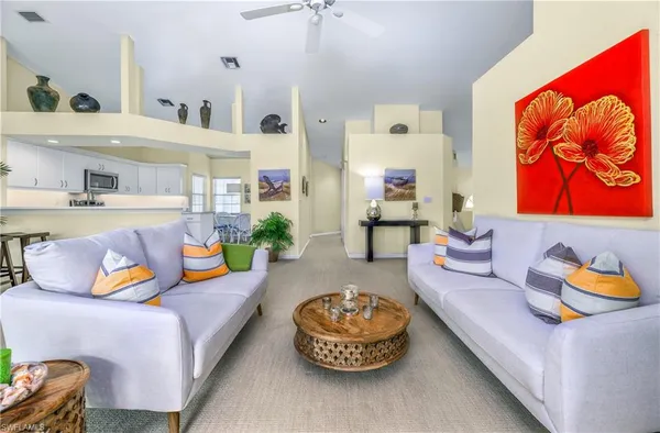 a living room with furniture and a rug