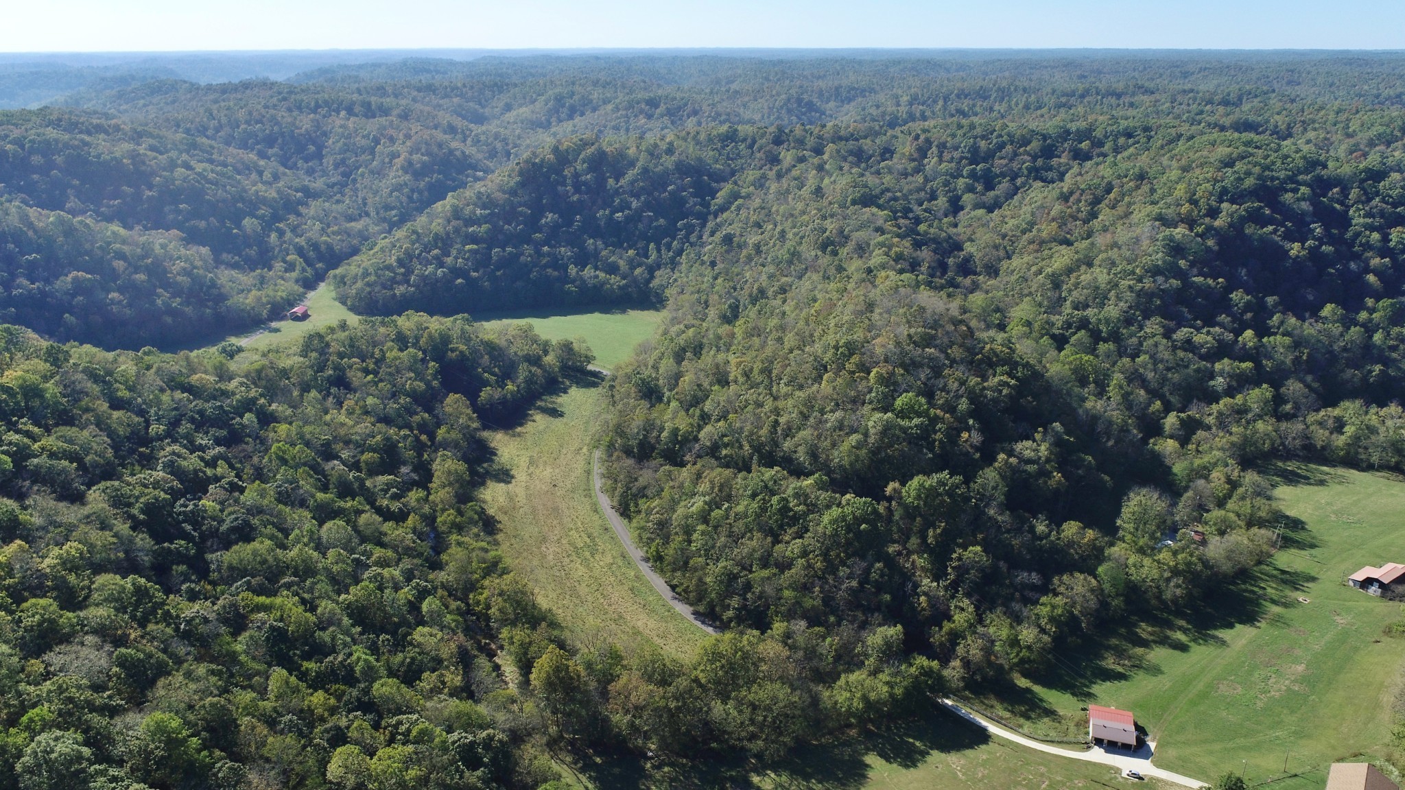 0 Pine Lick Road Whitleyville, TN 38588 - Photo 8 of 16 an aerial view of house with yard and mountain in the background