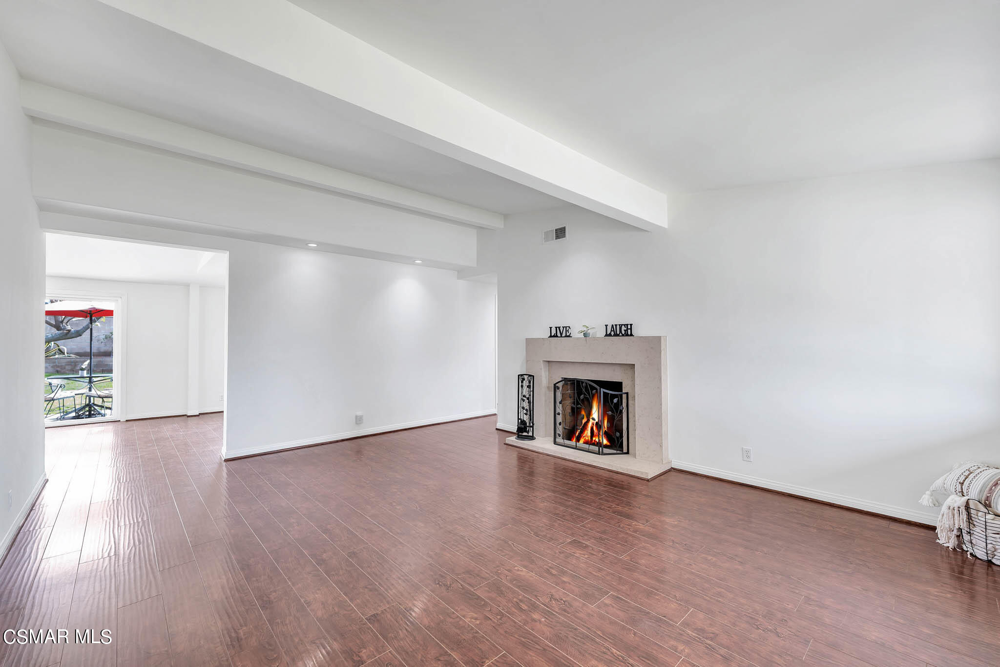 538 Mountaincrest Road Duarte, CA 91010 - Photo 3 of 63 an empty room with wooden floor fireplace and windows