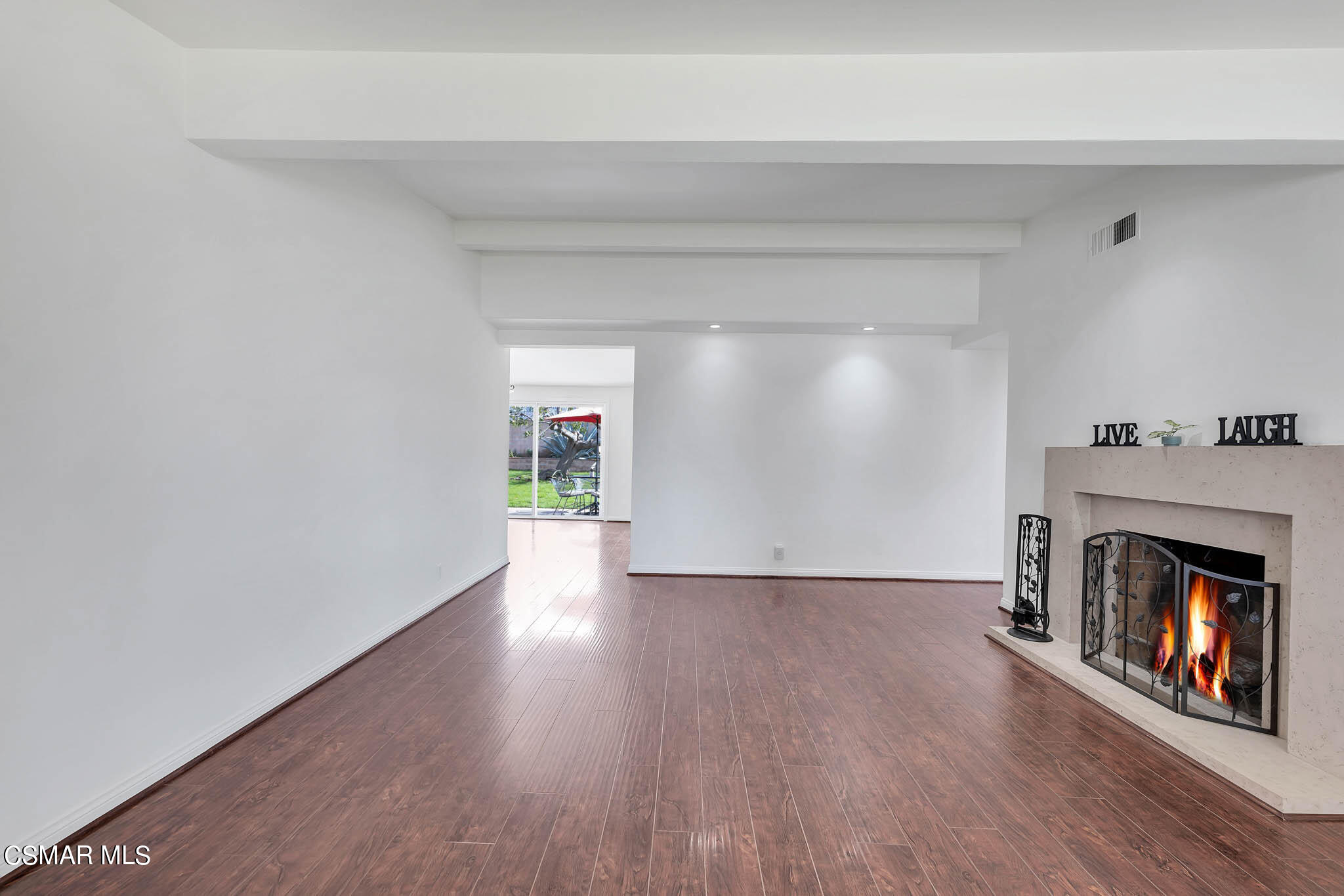 538 Mountaincrest Road Duarte, CA 91010 - Photo 4 of 63 a view of an empty room with wooden floor fireplace and a window