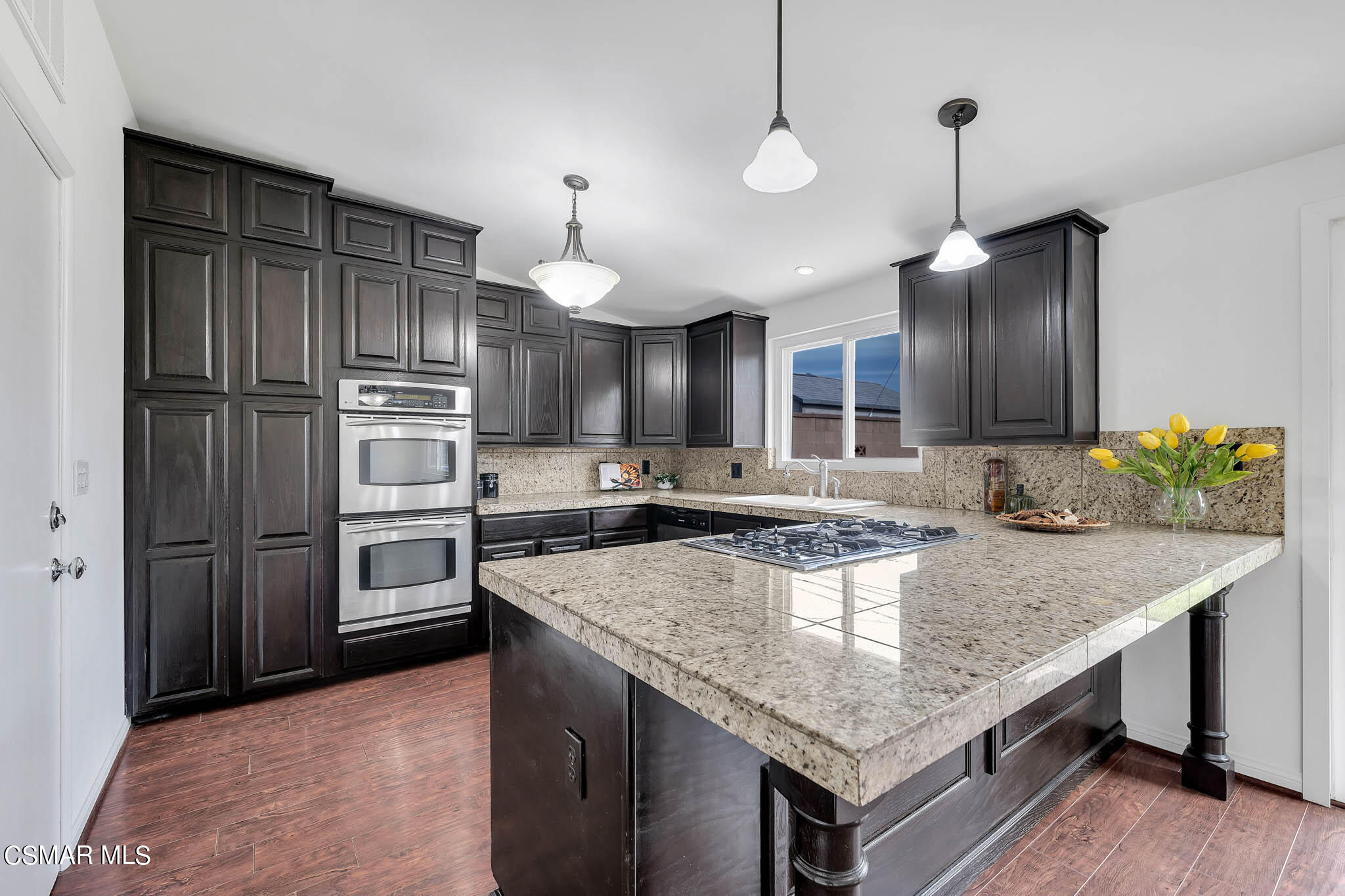 538 Mountaincrest Road Duarte, CA 91010 - Photo 8 of 63 a kitchen with kitchen island granite countertop wooden cabinets a refrigerator and a sink