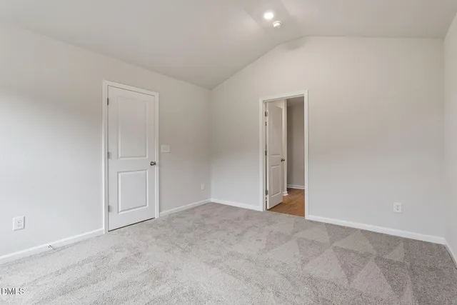 an empty room with closet area