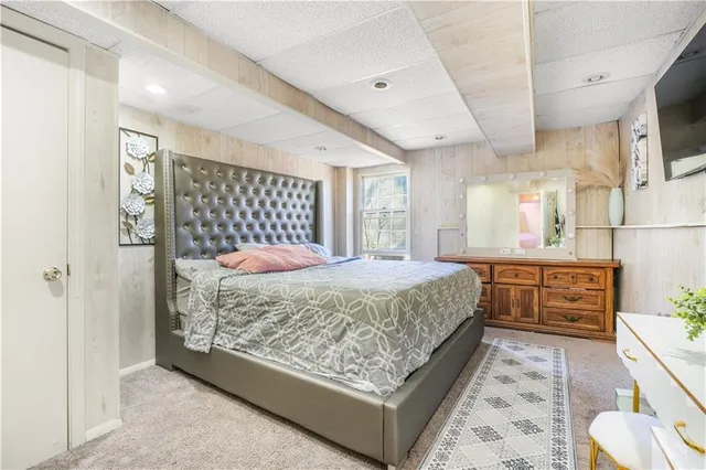 a bedroom with a bed and a cabinets